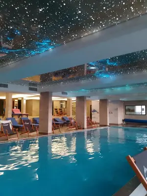 a swimming pool in a hotel with stars on the ceiling at Milmari Nlux 74 in Kopaonik