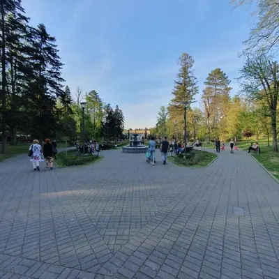 a group of people walking around a park at Zlatna iskra in Ruđinci