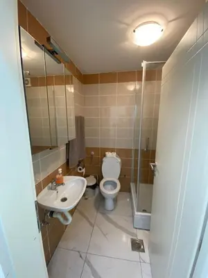 a bathroom with a toilet and a sink at Apartman Stivi Deluxs 2 in Vrnjačka Banja