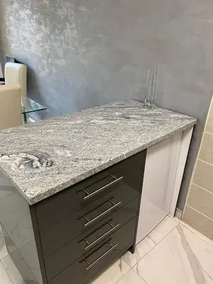 a granite counter top in a bathroom with a sink at Apartman Stivi Deluxs 2 in Vrnjačka Banja
