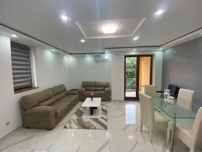 a living room with a couch and a table at Apartman Stivi Deluxs 2 in Vrnjačka Banja