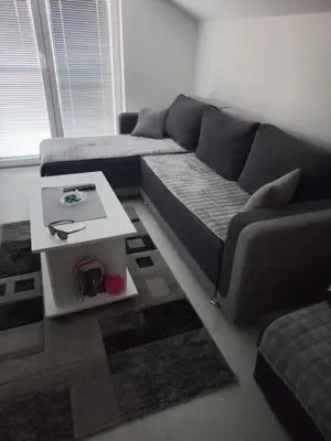 a living room with a couch and a table at Maki i Jeka in Soko Banja