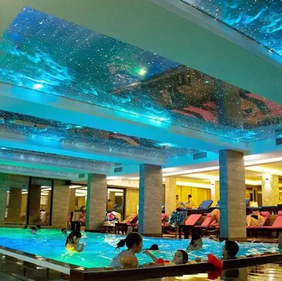a large swimming pool with people in it at RELAX MILMARI-kopaonik in Kopaonik