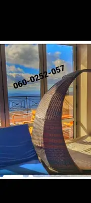 a hammock on a cruise ship looking out the window at RELAX MILMARI-kopaonik in Kopaonik