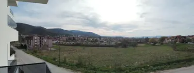 a view of a city with a field and buildings at Apartman Ida in Soko Banja