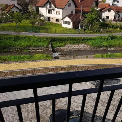 a view of a train track from a bridge at Apartman Ignjatović in Vrnjačka Banja
