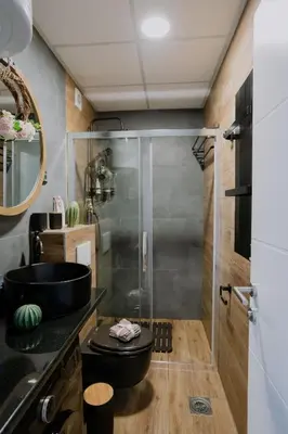 a bathroom with a shower and a sink and a toilet at Vrnjačka Promenada - Pešačka zona - Baby friendly in Vrnjačka Banja