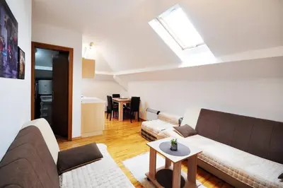 a living room with a couch and a table at Apartman Dačić in Vrnjačka Banja