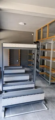 a group of stairs in a room with shelves at AURORA Bela reka C117, Brzeće in Brzeće