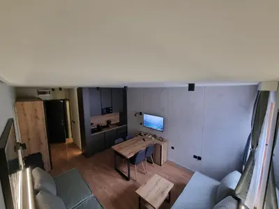 an overhead view of a living room with a table at AURORA Bela reka C117, Brzeće in Brzeće