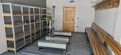 a row of benches in a room with a door at ANIMA Bela reka C121, Brzeće in Brzeće