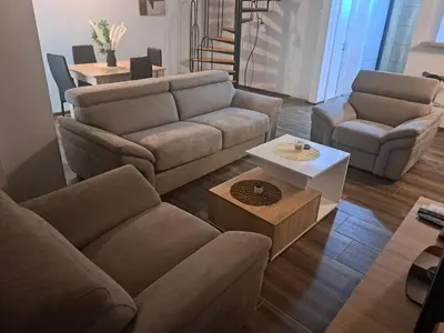 a living room with a couch and a table at Daka in Vrnjačka Banja