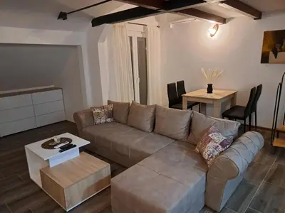 a living room with a couch and a table at Daka in Vrnjačka Banja