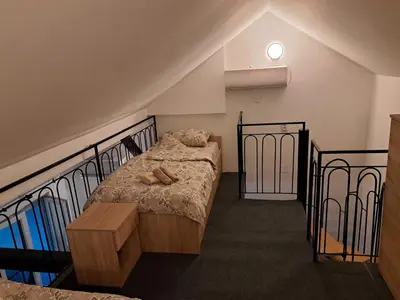 a bedroom with a bed with shoes on it at Daka in Vrnjačka Banja